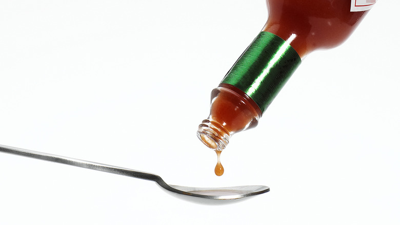 Tabasco sauce with spoon