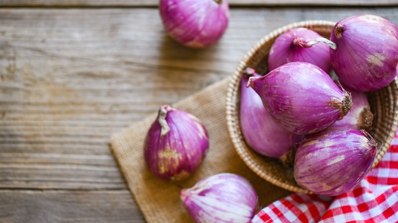 Shallots in wicker bowl