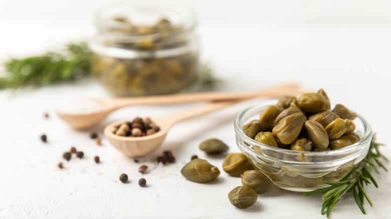 Bowl and spoon with capers 