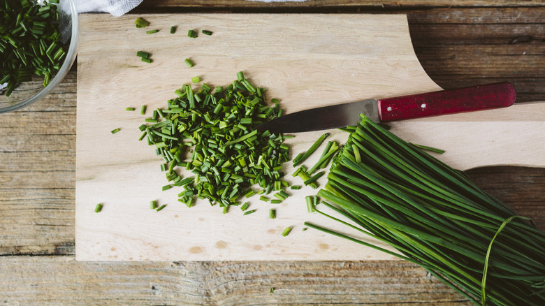 Minced chives on cutting board 