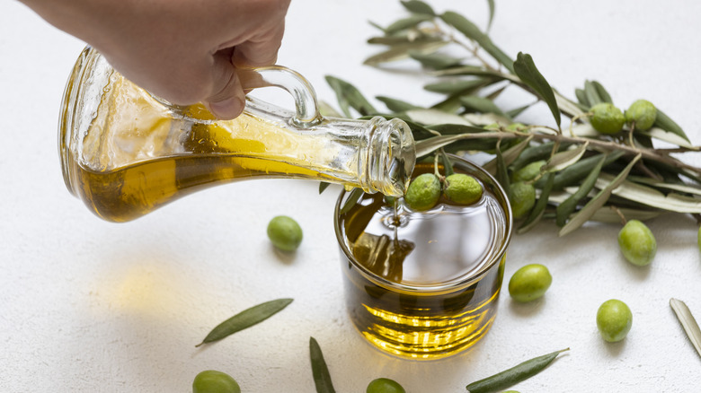 Pouring fresh pressed olive oil