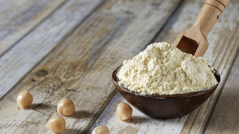 Bowl of chickpea flour with chickpeas and scoop