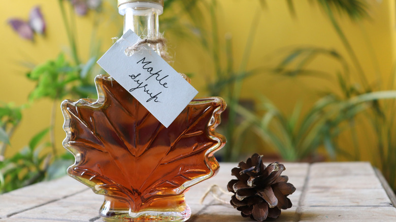 Glass bottle of maple syrup