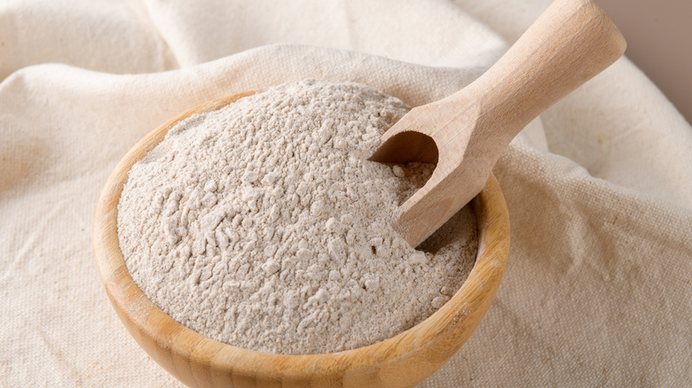 Wooden bowl of buckwheat flour