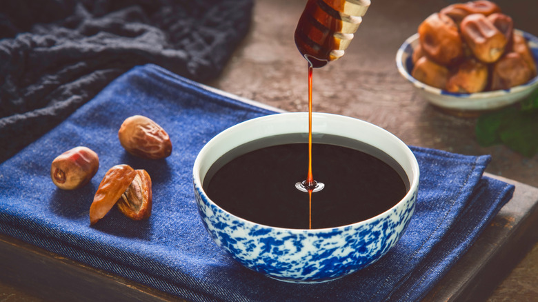 Bowl of fresh date syrup