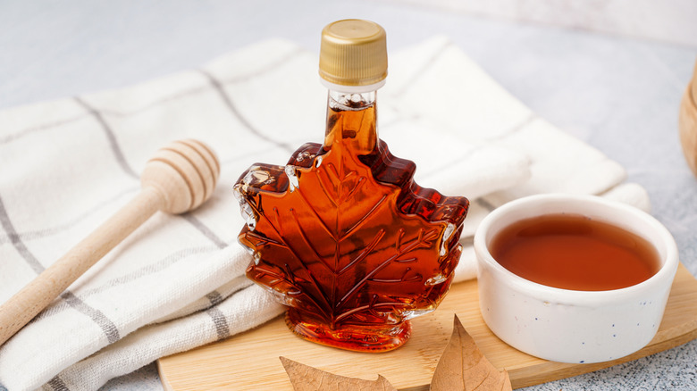 Glass bottle of maple syrup