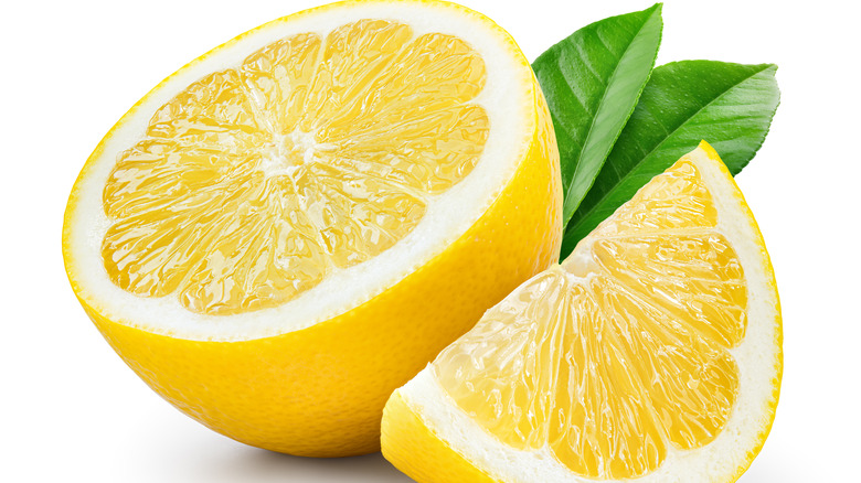 sliced lemon white background