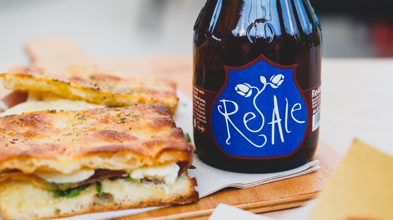 A bottle of Birra del Borgo ReAle with food