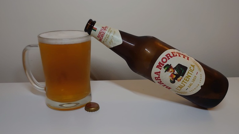 A bottle of Birra Moretti L'Autentica with a full glass