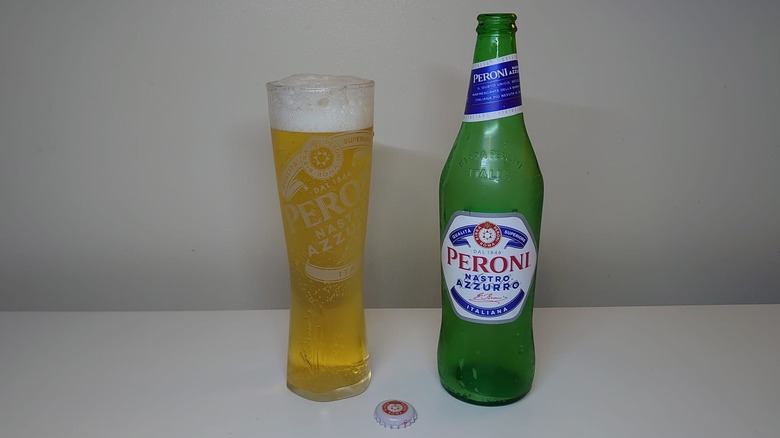 A bottle of Peroni Nastro Azzurro with a full glass