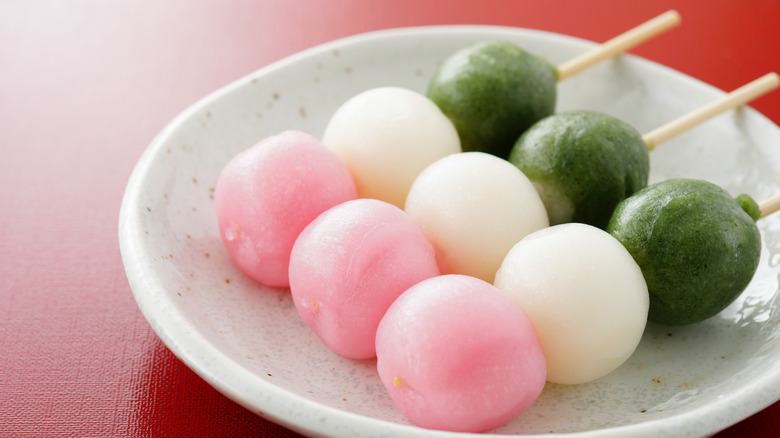 Pink, green, white skewers of dango