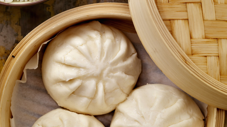 Pork buns in bamboo steaming basket