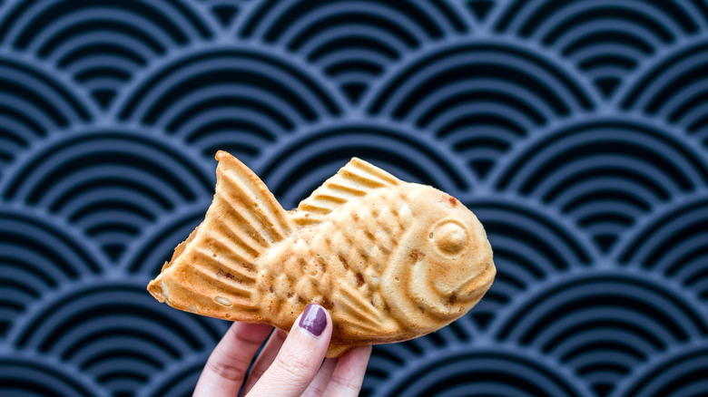 Taiyaki fish cake against blue wall