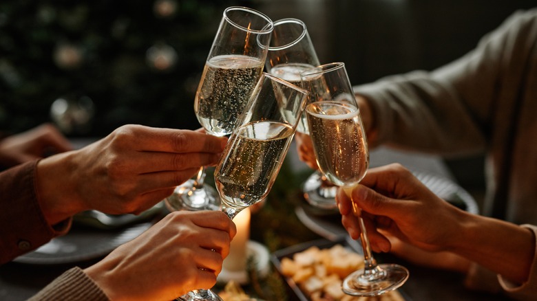 People toasting Champagne flutes