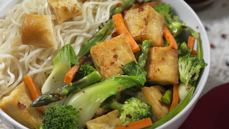 Tofu stir-fry with noodles in bowl