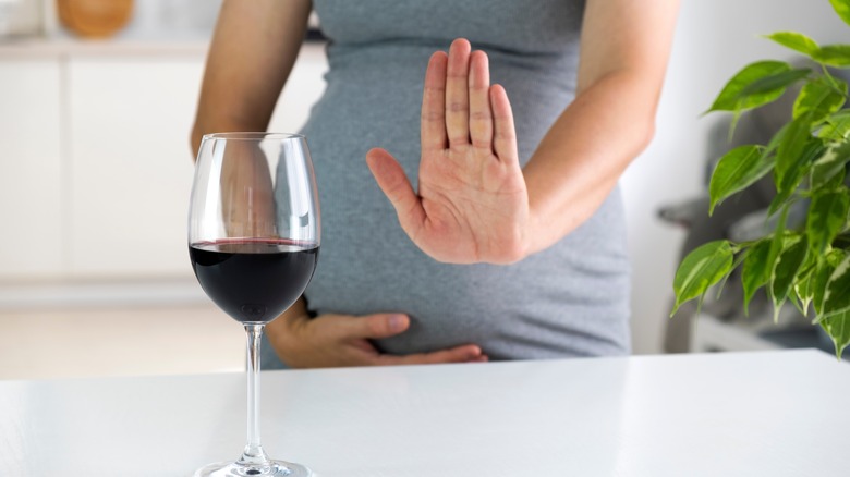 pregnant woman saying no to wine