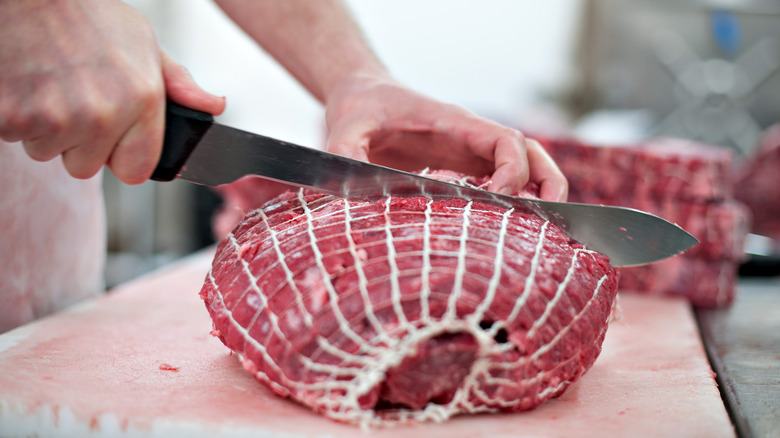 Beef chuck being cut