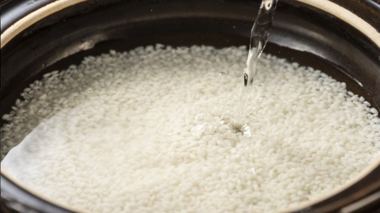 Sushi rice being rinsed