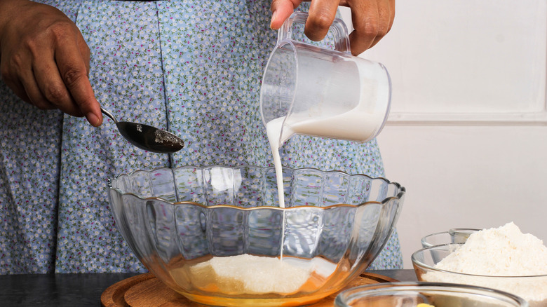 Person baking cornbread in kitchen