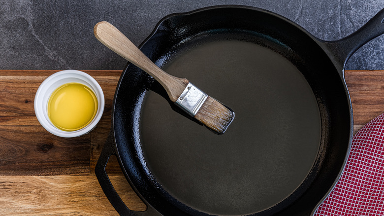 Brushing cast iron skillet