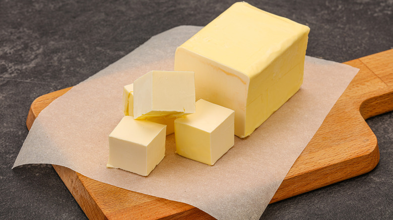 Yellow butter on cutting board 