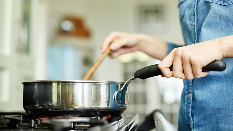 Person using a frying pan