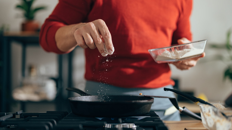 Adding salt to a pan