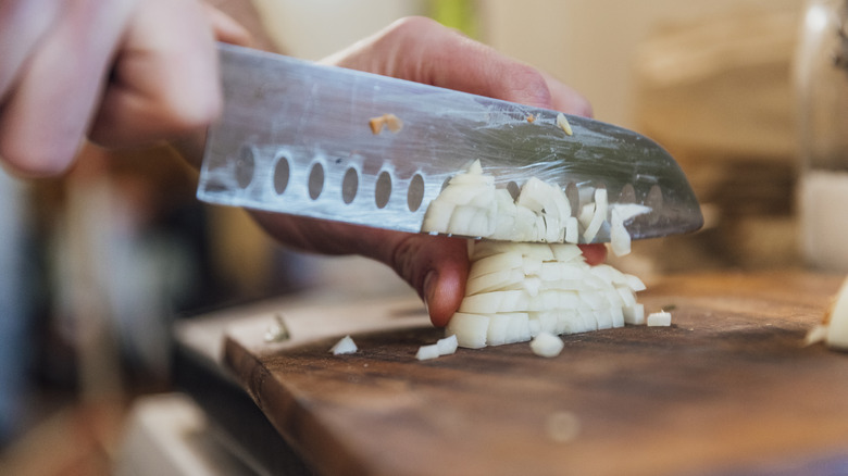 Knife dicing onions