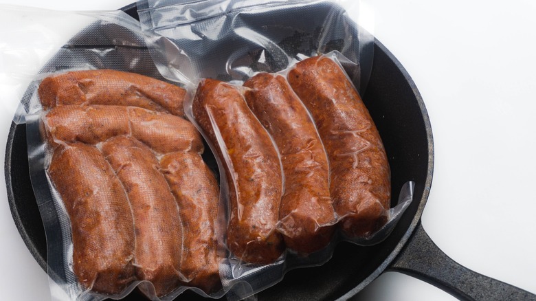 Vacuum-sealed frozen meat in pan