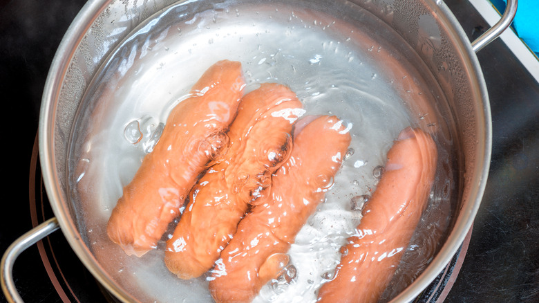 Boiling sausage in pot