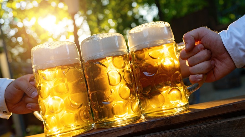 Bavarian beer mugs with hands