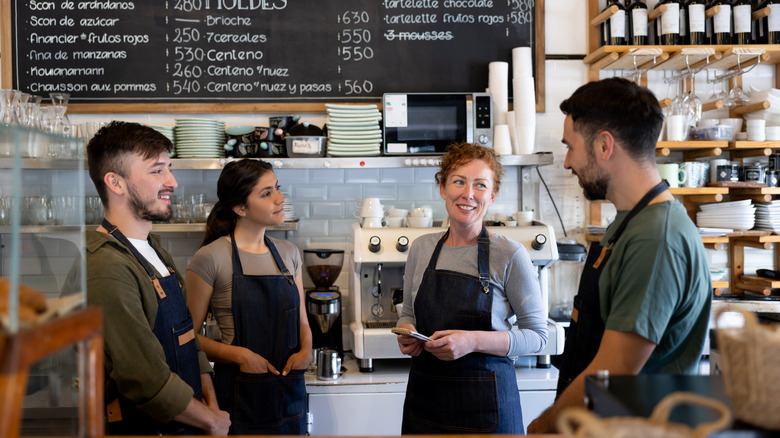 baristas talking at counter