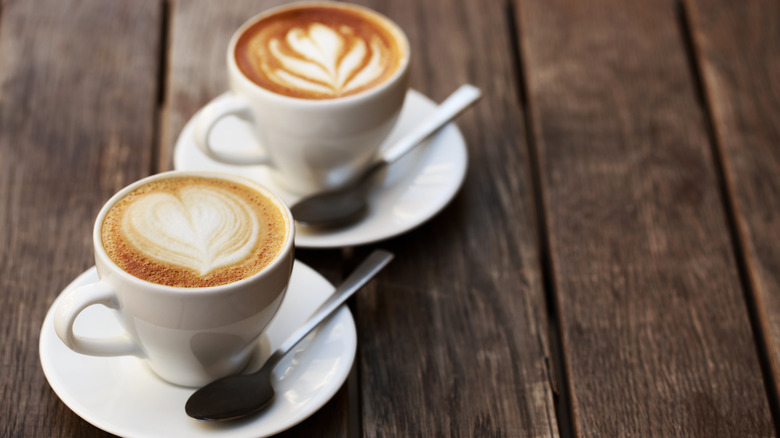 two latte art cups