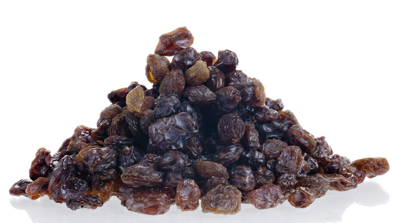 A pile of raisins with a white background