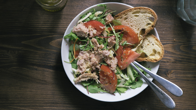 A plate of tuna salad served on bread slices