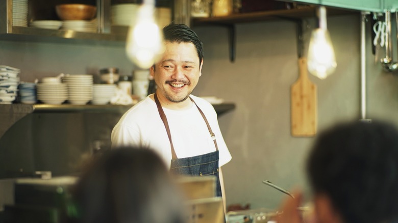 Smiling Japanese pub chef