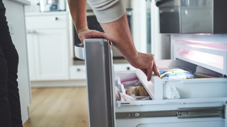 person opening the freezer