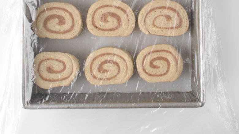 Covered cinnamon rolls rising