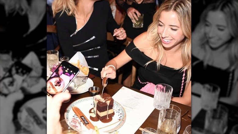 Filming Catch's Hit Me Cake at the table