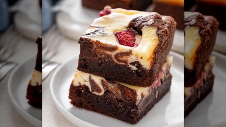 Close-up of a cheesecake brownie with raspberry