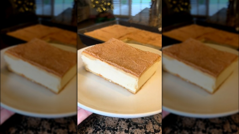 Churro cheesecake slice on a white plate