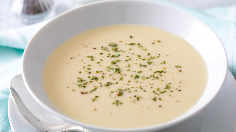 Vichyssoise soup in white bowl