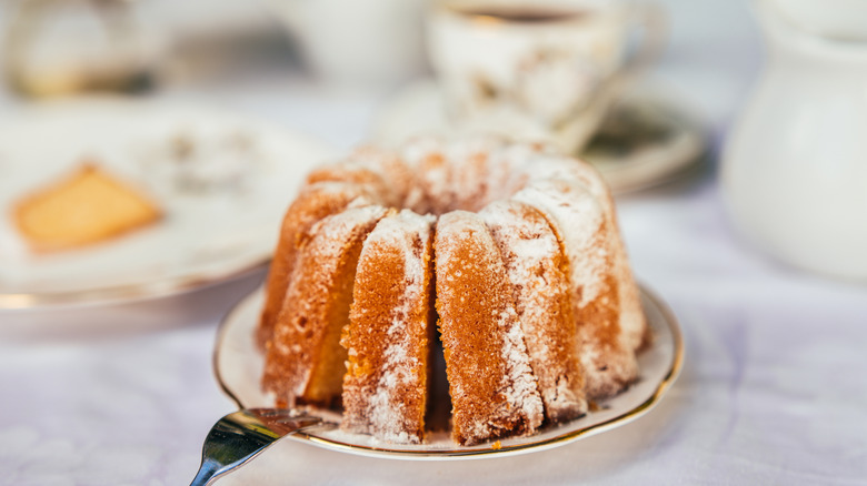 Harvey Wallbanger cake topped with icing on a plate ready to serve