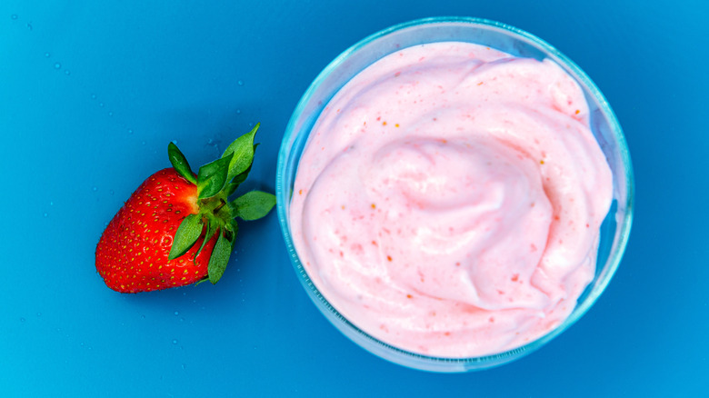 Bowl of pink pudding with berries