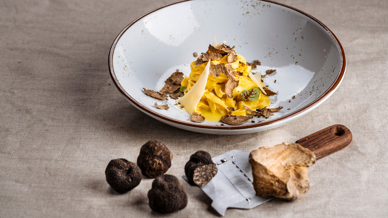 Black truffles shaved onto pasta