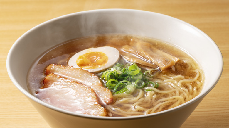 Bowl of hot ramen on table