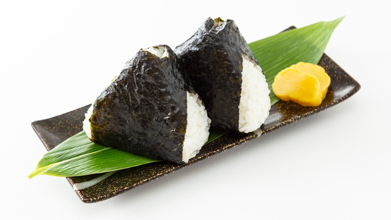 Onigiri on a plate against white