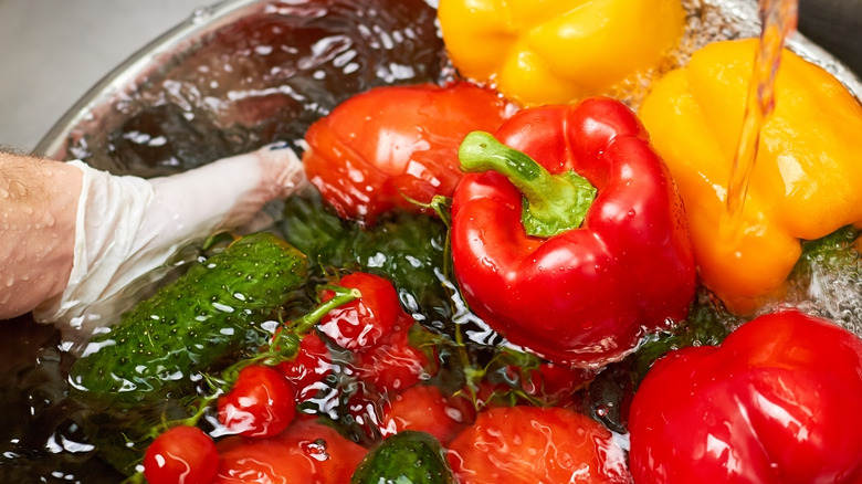 Person washing vegetables