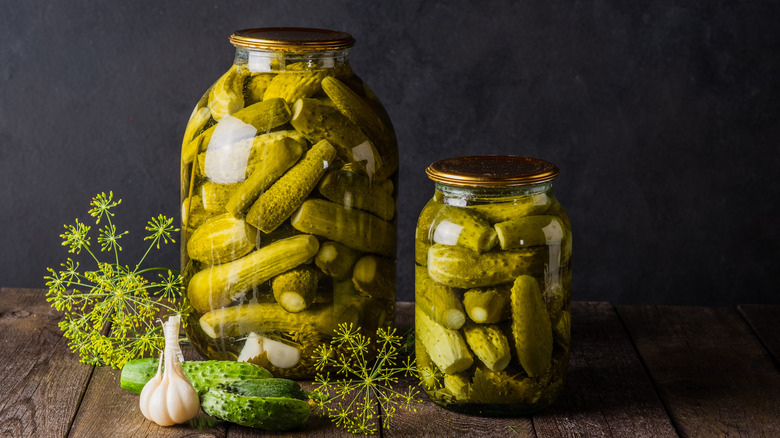 Two dill pickle jars