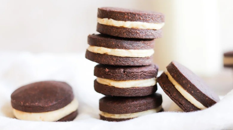 A stack of chocolate peanut butter and hazelnut sandwich cookies